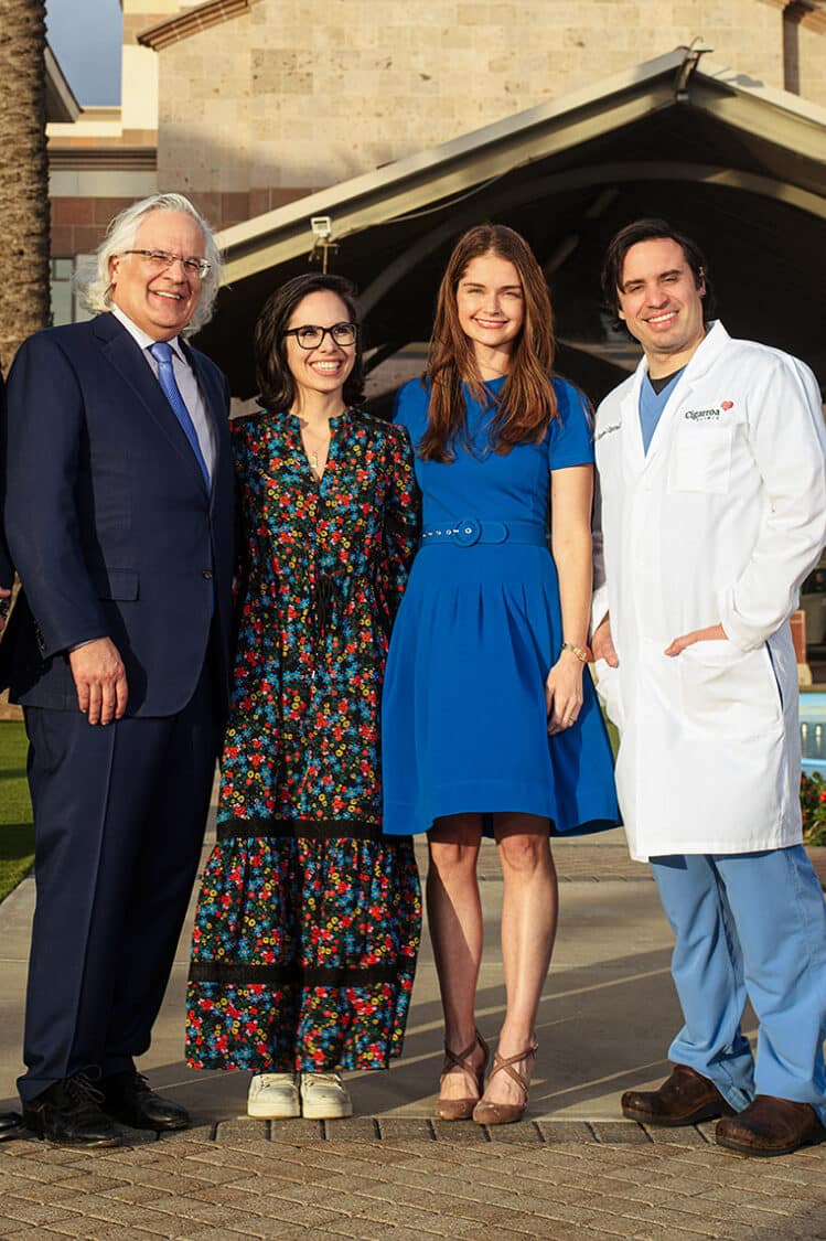 Four members of the Cigarroa family standing together outdoors in Laredo, Texas.